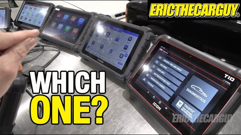 A collection of professional and DIY automotive scan tools and tablets on a garage workbench.
